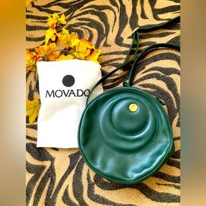Movado Classic round cross body bag.